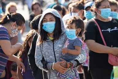 Migrants at a makeshift camp near the border crossing in Tijuana, Mexico, receive food and other relief supplies from the New Covenant Methodist Church and San Pablo Evangelical Church in Tijuana. Some 1,500 immigrants settled there, many of them hoping to file asylum claims with U.S. immigration authorities. Photo by Mike DuBose, UM News. Migrants at a makeshift camp near the border crossing in Tijuana, Mexico, receive food and other relief supplies from the New Covenant Methodist Church and San Pablo Evangelical Church in Tijuana. Some 1,500 immigrants settled there, many of them hoping to file asylum claims with U.S. immigration authorities. Photo by Mike DuBose, UM News.