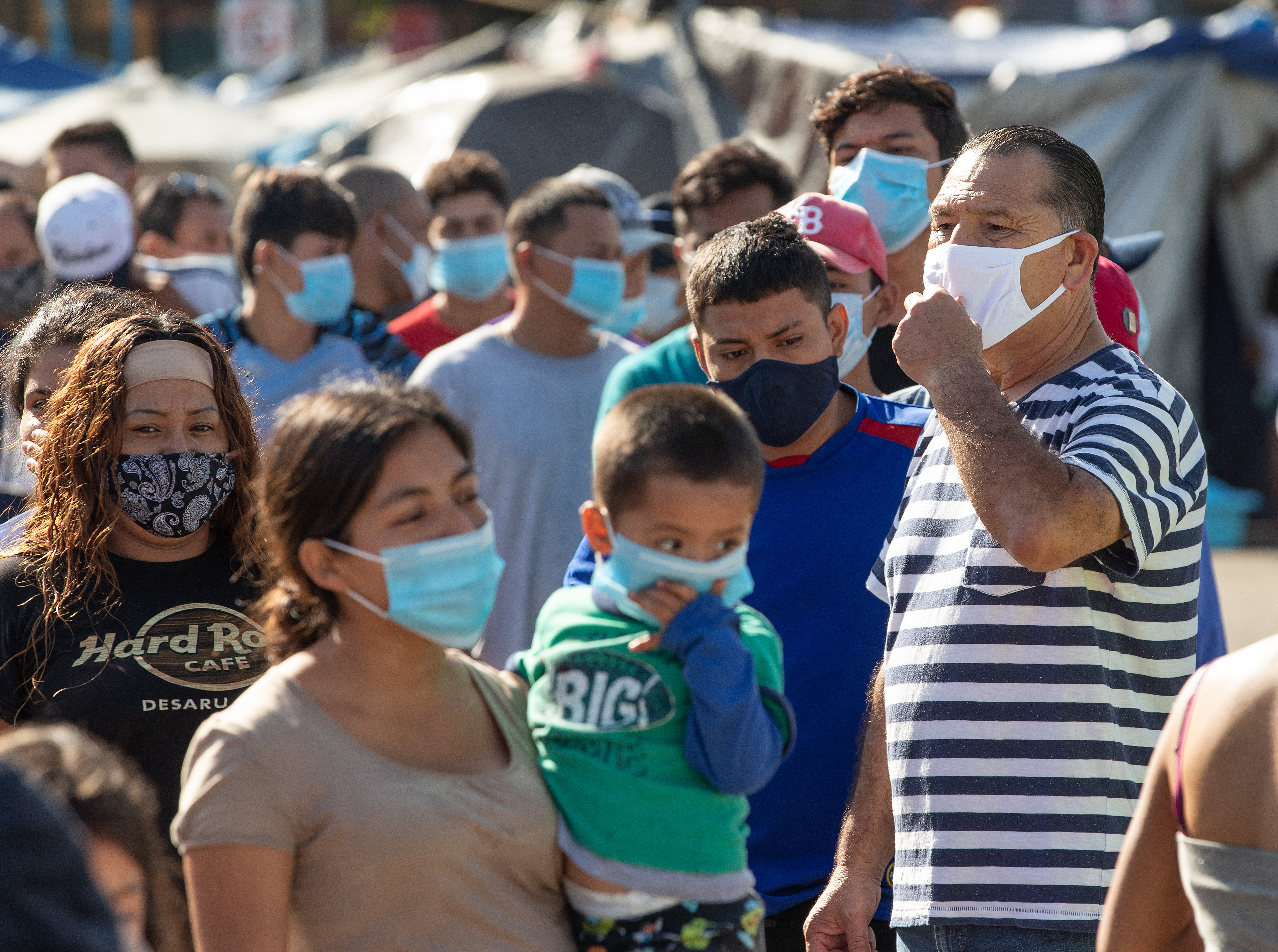 The Rev. Arturo González Sandoval (right) joins volunteers from the New Covenant Methodist Church and the San Pablo Evangelical Church in Tijuana, Mexico, to organize the distribution of food, clothing and sanitary supplies for migrants living in a border camp in Tijuana. Sandoval is superintendent of the Peninsula District of the Northwest Conference of the Methodist Church in Mexico A.R. and chairman of the church's National Commission on Immigration Affairs. Photo by Mike DuBose, UM News.