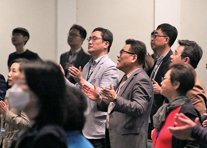 Participants in the Association of Korean Churches in The United Methodist Church gathering sing praise songs at Central Korean United Methodist Church in Dallas. Photo by the Rev. Thomas Kim, UM News.