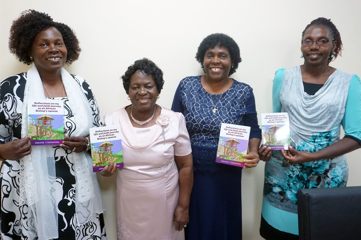 Despite being denied an education as a girl, Greater Taremeredzwa Nhiwatiwa (second from left) went on to become a nurse and church leader in her role as an African bishop’s spouse. Nhiwatiwa, who is president of the Zimbabwe Episcopal Area Rukwadzano RweWadzimai (RRW) women's organization, shares her life story in a new book, “Reflections on My Life and Faith Journey as an African Bishop’s Spouse.” Pictured with Nhiwatiwa at the Zimbabwe West Annual Conference main office are Anesu Mironga, Zimbabwe East Annual Conference secretary (left), Tendai Rebecca Gurupira, RRW vice president (third from left), and Ethel Tsingano, RRW secretary. Photo by Kudzai Chingwe, UM News.