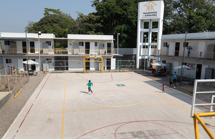 A boy runs across the basketball court at the Hospitalidad y Solidaridad migrant shelter in Tapachula, Mexico. Photo by Mike DuBose, UM News.