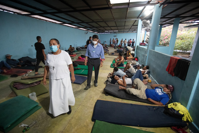 Olga Sánchez Martínez (front) gives a tour of the Jesús el Buen Pastor migrant shelter in Tapachula, Mexico, to the Rev. Joel Hortiales. Hortiales, a United Methodist missionary who serves as director of Hispanic/Latino ministries and border concerns for the California-Pacific Conference, was part of a group of leaders from the Methodist Church of Mexico and The United Methodist Church who traveled to southern and central Mexico to learn more about migration-related ministries there. Photo by Mike DuBose, UM News.