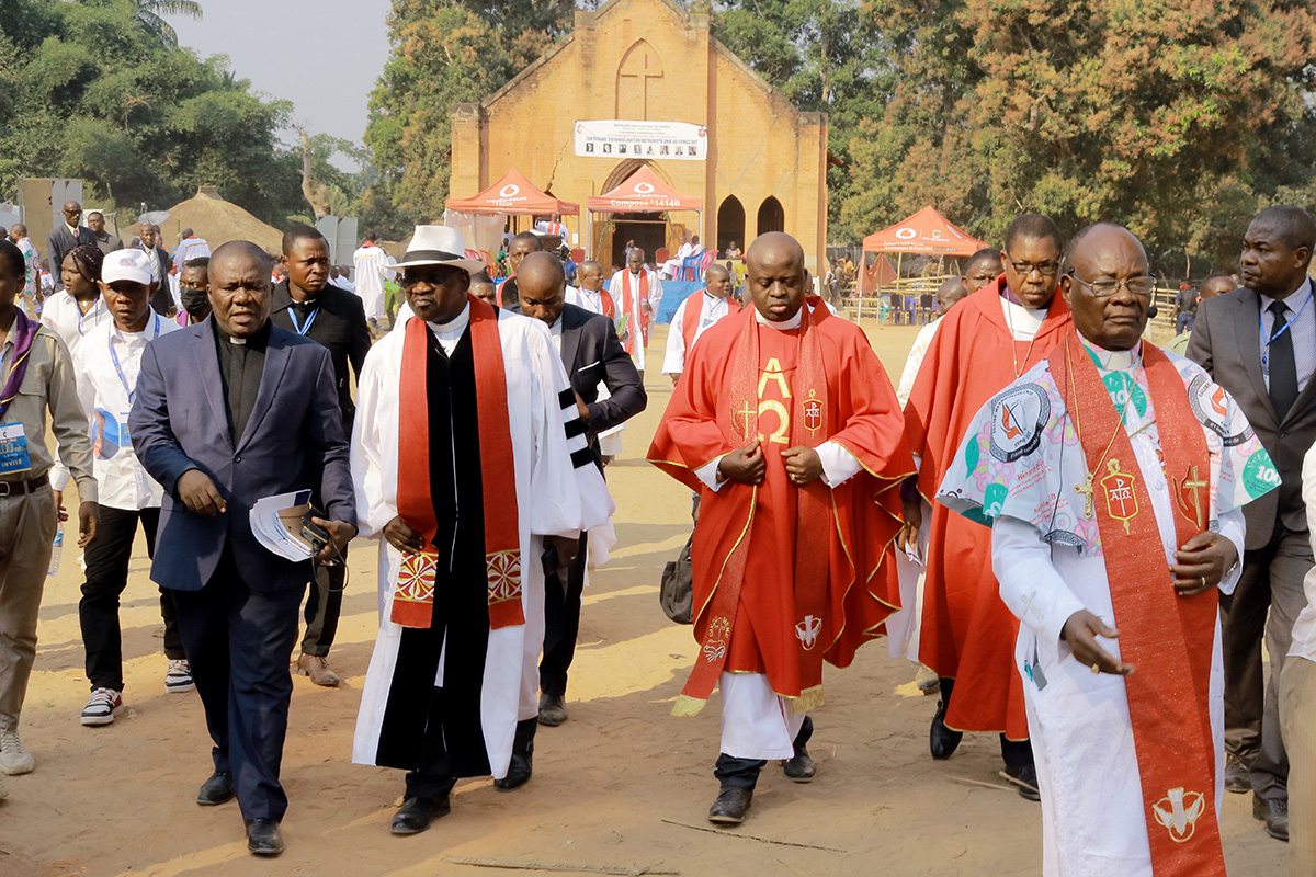 United Methodist Bishop Gabriel Yemba Unda (right) leads the procession to the 100th anniversary celebration for Methodism in Congo. The celebration was held in Tunda, site of a former Methodist mission station and hospital. Photo by Philippe Kituka Lolonga, UM News.