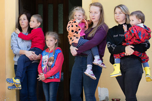 Women and children who fled their homes in Ukraine to escape the war with Russia are being hosted at the Poušť United Methodist church camp near Bechyně, Czech Republic. Some 19 guests from Ukraine are living there. At center is Alžběta Opočenská, a staff member at the camp. Photo by Mike DuBose, UM News.