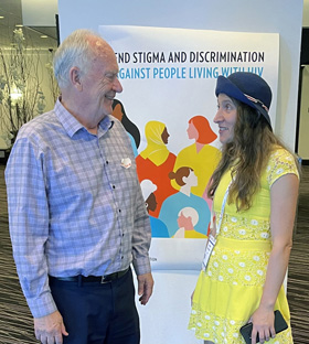 The Rev. Dr. Donald E. Messer, United Methodist Global AIDS Committee, listens to Valerie Rachynska from Kyiv, Ukraine, describe the wartime conditions of persons living with HIV in Ukraine. Photo courtesy of Don Messer.