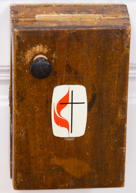 A box for offerings hangs from the sanctuary door at Nyíregyháza (Hungary) United Methodist Church. Photo by Mike DuBose, UM News.