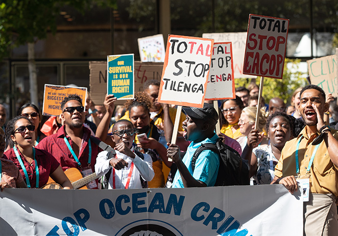 Activists call attention to climate change during a protest at the World Council of Churches' 11th Assembly in Karlsruhe. Photo by Mike DuBose, UM News.