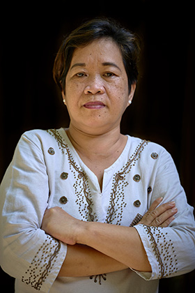 The Rev. Glofie Baluntong poses for a photo in Manila, Philippines. The United Methodist pastor is living in Manila after leaving the Philippine island of Mindoro, where she was charged with attempted murder. Baluntong and her supporters claim she is innocent, and that the charges are part of a larger campaign of "red-tagging" designed to silence her and other activists who support the rights of indigenous people and the poor throughout the country. Photo © Paul Jeffrey, Life on Earth Pictures.