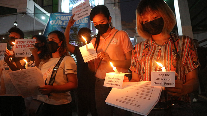 Supporters of the Rev. Glofie Baluntong in Cabanatuan City, Philippines, call on the government to drop charges against the United Methodist pastor. Baluntong, a former district superintendent and longtime deaconess, has been charged with attempted murder and is facing questions related to the country’s Anti-Terror Law. Photo by Gladys P. Mangiduyos, UM News.