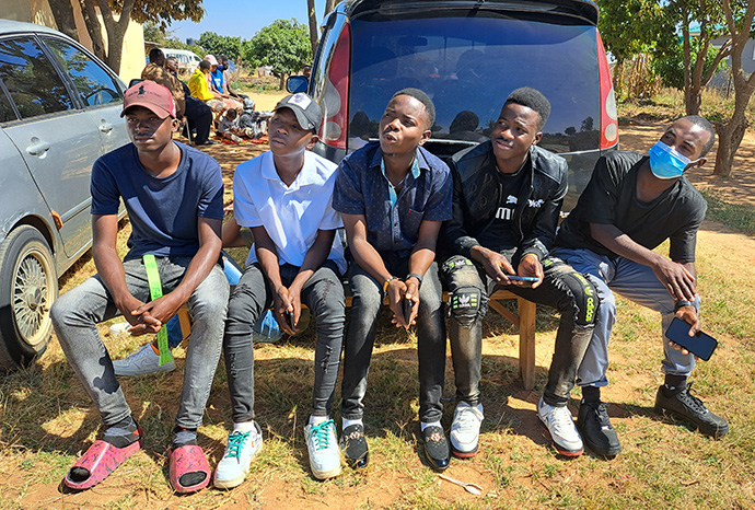 Young men take part in a community Bible study class in Chitungwiza. Participants learn how to read and understand the Bible in a small-group setting. Photo by Priscilla Muzerengwa, UM News.