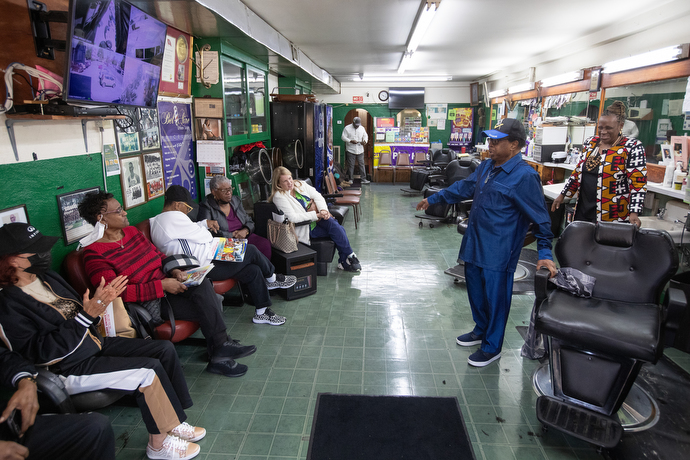 Jake Sherrell leads well-wishers in “Leave It There,” a hymn by Charles A. Tindley, at his barbershop. Photo by Mike Dubose, UM News.