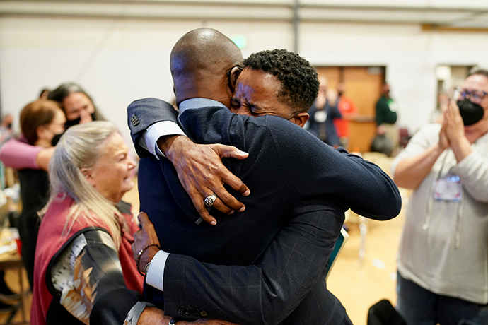 Bishop Cedrick Bridgeforth, a United Methodist elder in the California-Pacific Conference, embraces his husband, Christopher Hucks-Ortiz, after his election was announced. Bridgeforth was elected to the episcopacy on the 18th ballot by the Western Jurisdiction on Nov. 4 at Christ United Methodist Church in Salt Lake City. Photo by Patrick Scriven (Pacific Northwest) for the Western Jurisdiction.