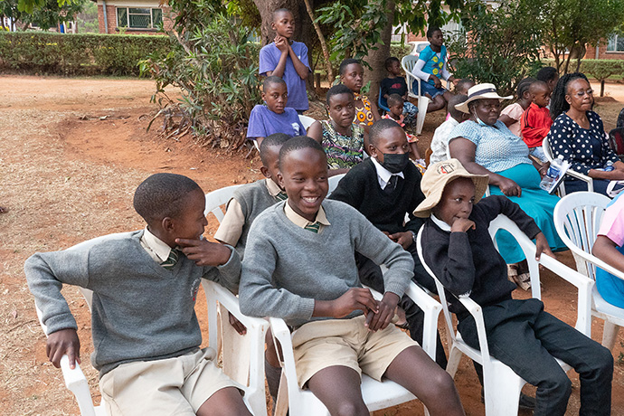 Children and caretakers from the Fairfield Children’s Home gather to watch the presentation of funds donated to the home by the United Methodist South Carolina Conference. The home for orphans is on the grounds of United Methodist Old Mutare Mission, which is across the valley from United Methodist-related Africa University. Photo by Kathy L. Gilbert.