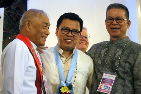 Newly elected Bishop Israel M. Painit (center) is greeted by retired Bishop Solito K. Toquero and Bishop Ciriaco Q. Francisco after Painit’s election during the Philippines Central Conference at Wesleyan University-Philippines in Cabanatuan City, Philippines. Painit was the third bishop elected at the Nov. 24-26 meeting. Photo by Gladys P. Mangiduyos, UM News.
