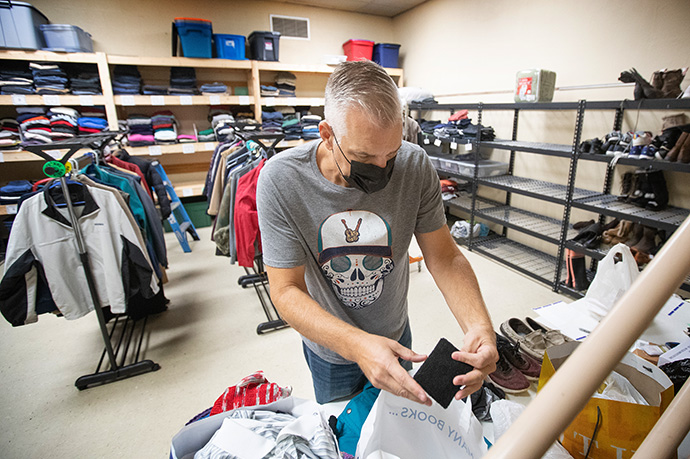 The Rev. Jeff Streszoff sorts donated items at the Clothes Closet ministry of McKendree United Methodist Church in Nashville, Tenn. Streszoff is pastor of Grace United Methodist Church in Mt. Juliet, Tenn. Members and leaders at Grace, a suburban church near Nashville, often volunteer at McKendree in Nashville’s city center. Photo by Mike DuBose, UM News.