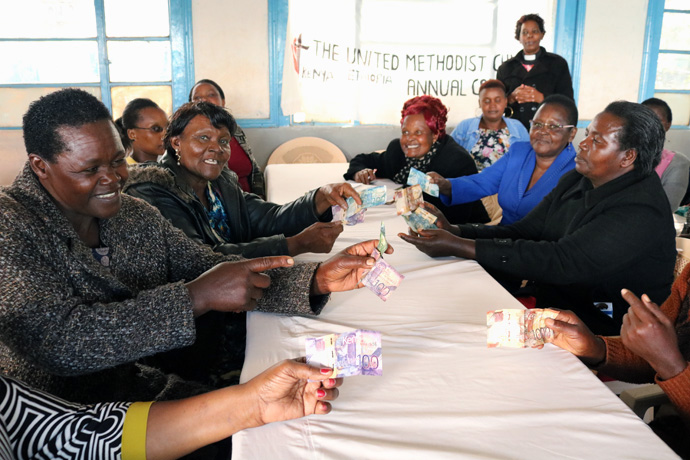 Women gather at Makutano United Methodist Church in Meru County, Kenya, to collect money and disburse soft loans during a monthly table-banking exercise. Thirty-one United Methodist churches conduct table-banking meetings each month in the Eastern Kenya district of the Kenya-Ethiopia Conference. Photo by Gad Maiga, UM News.