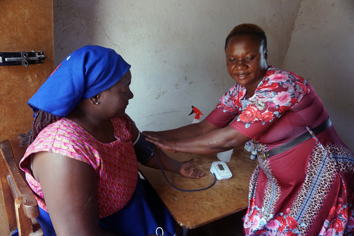 Alta Chitsanzara (left) from Zvimba Village has her blood pressure taken by a medical professional during Runyange United Methodist Church’s outreach in the Makoni Buhera District. The church offered free medical and dental services to nearly 350 patients who had struggled to access health care in the rural area. Photo by Kudzai Chingwe, UM News.