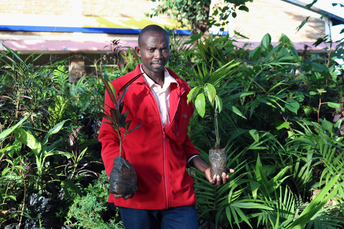 James Muirigi works at a flower and fruit-tree nursery. Muirigi received training in plant production courtesy of Youth for Christ in Meru. He has grown the nursey from 200 to 2,000 plants in less than a year. Photo by Gad Maiga, UM News.