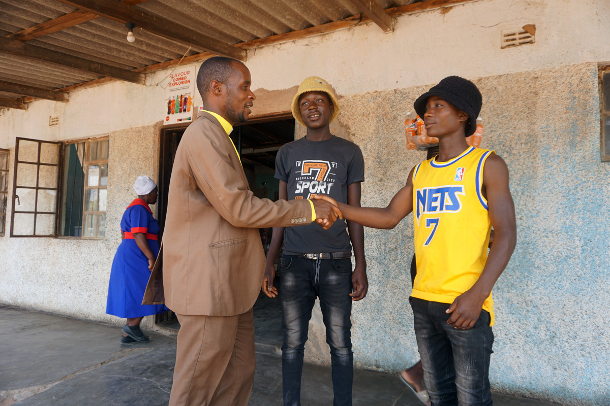 The Rev. Tapiwa Nyangani greets two artisan miners during a special crusade to bring people to Christ in the Marange District in the Zimbabwe East Conference of The United Methodist Church. The three-day event brought the Gospel to 238 villagers’ homes. Photo by Kudzai Chingwe, UM News.