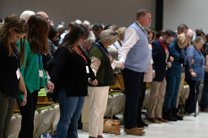 The North Carolina Conference pauses for prayer during a Nov. 19, 2022, special session to consider approving churches for disaffiliations. A new Lewis Center for Church Leadership report shows that the South and Southwest are by far the leading regions for churches departing The United Methodist Church. File photo by Amanda Packer, courtesy of the North Carolina Conference. 