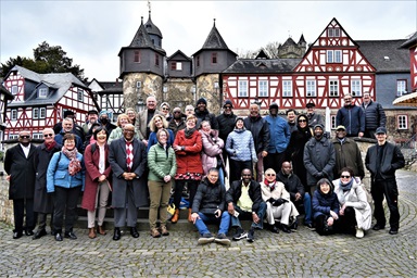 The Standing Committee on Central Conference Matters, an international United Methodist leadership body, gathers in front of the entrance to a medieval castle in Braunfels, Germany. During a meeting in Braunfels, the group discussed the challenges facing its proposed Africa Comprehensive Plan, which would add five more bishops to the continent. Photo by Klaus Ulrich Ruof, Germany Central Conference.   The Standing Committee on Central Conference Matters, an international United Methodist leadership body, gathers in front of the entrance to a medieval castle in Braunfels, Germany. During a meeting in Braunfels, the group discussed the challenges facing its proposed Africa Comprehensive Plan, which would add five more bishops to the continent. Photo by Klaus Ulrich Ruof, Germany Central Conference.