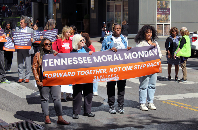 Demonstrators carry a banner during an April 17 “Moral Monday” rally in Nashville, Tenn., that drew more than 1,000 people in support of stricter gun laws. United Methodist clergy and laity were among the participants at the event, which was organized by a social justice organization in the wake of the deadly mass shooting at The Covenant School in Nashville. Photo by Vernon Jordan, UM News.