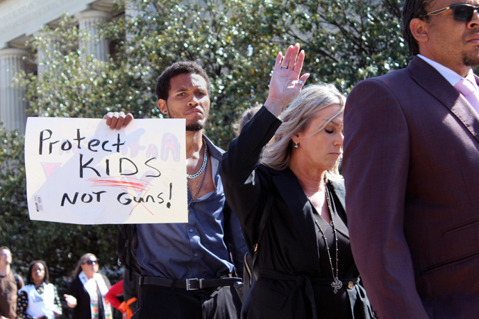 A man holds a sign urging gun reform outside of the state Capitol building in Nashville, Tenn., on April 17. More than a thousand people marched in support of stricter gun laws during the “Moral Monday” rally organized by Repairers of the Breach, a North Carolina social justice organization. Photo by Vernon Jordan, UM News.