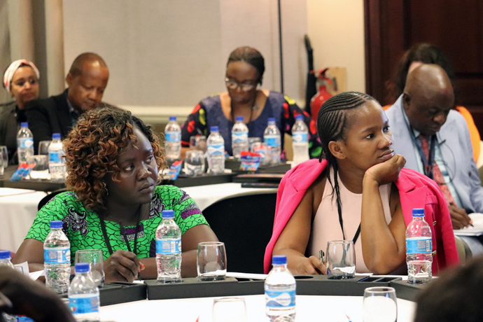 Jaka Joice Damiano Lokolo (left), women president from the Uganda-South Sudan Annual Conference, and Zoleka Primrose Masiza, young adults president from the South Africa Provisional Annual Conference, follow proceedings during the Global Ministries Africa Mission Consultation April 17-19 in Maputo, Mozambique. The meeting was to chart the way forward for mission on the continent. Photo by the Rev. Isaac Broune, UM News.