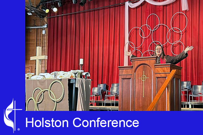The Rev. Sarah Slack preaches at a Monday morning Bible study and Holy Communion service, amid the worship visuals she created. Photo by Sarah Varnell, the Holston Conference.