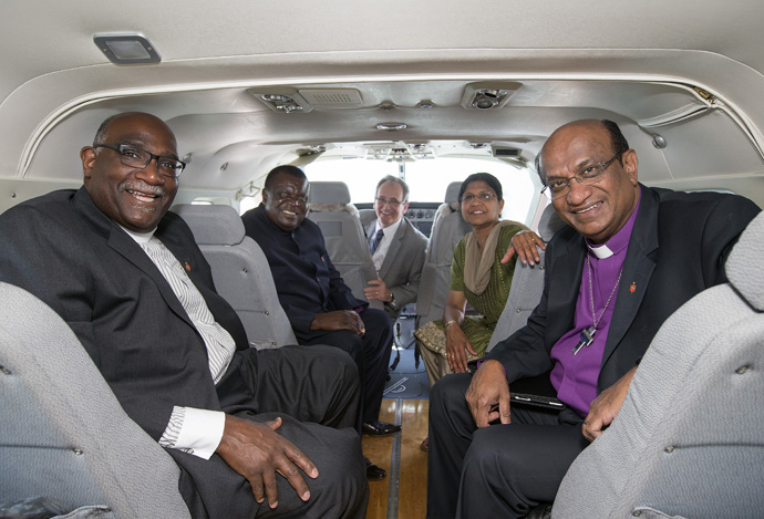 United Methodist church leaders, including Bishop Sudarshana Devadhar (right), sit in the new Wings of the Morning airplane during a celebration of blessing at Dayton International Airport in Ohio in 2013. Devadhar is joined in this picture by (from left) Bishops Gregory V. Palmer and Nkulu Ntanda Ntambo as well as George Howard and the bishop’s wife, Prema Devadhar. File photo by Mike DuBose, UM News.