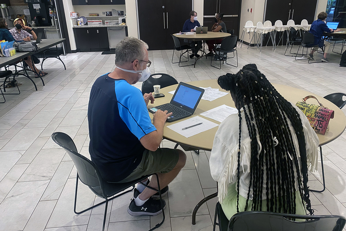 Volunteers for the ID Ministry at Foundry United Methodist Church in Washington, D.C., provide in-person consultations with clients. The program was created to help secure documents like birth certificates and social security cards for low-income and unhoused residents. Photo by Jackie Wright, Foundry United Methodist Church.