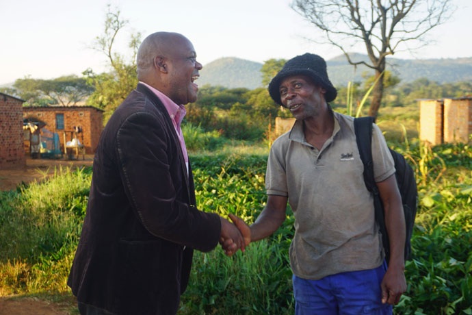 Edward Mudzingwa (right) of Samudzimu Farm in the Zimbabwe Episcopal Area is happy to meet Associate Pastor Mabasa Muzhizhizhi. Mudzingwa is one of the new converts gained during an evangelism initiative begun by the Mubvuwi weUnited Methodist men’s group. Photo by Kudzai Chingwe, UM News.