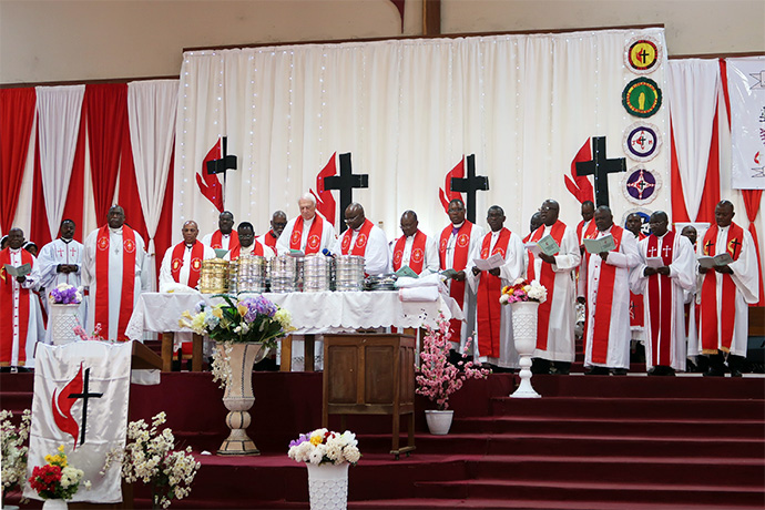 Bishops lead communion at the Memorial du Centenaire Cathedral at the opening worship service for the Africa Colleges of Bishops learning retreat in Lubumbashi, Congo, Sept 3. This year’s bishops meeting discussed regionalization, the definition of marriage and the future of The United Methodist Church in Africa, among other issues. Photo by Eveline Chikwanah, UM News.   