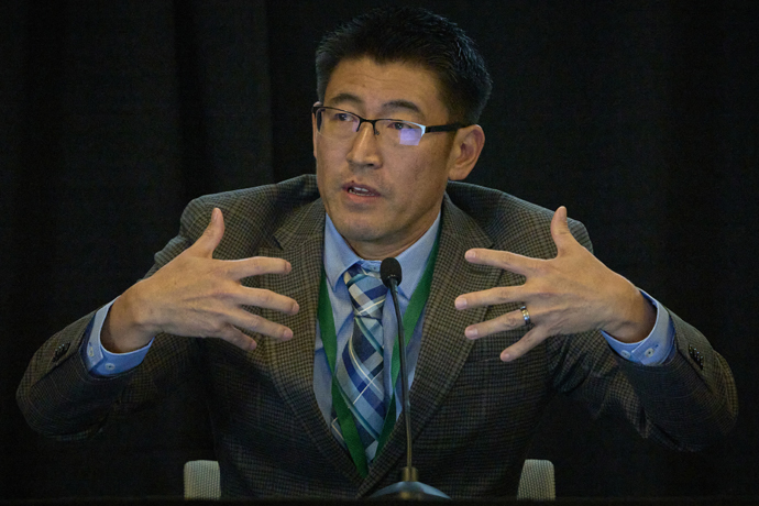 The Rev. Shinya Goto testifies on Sept. 20, the second day of a church trial of Bishop Minerva G. Carcaño in Glenview, Illinois. Goto, a witness for the church, is superintendent of the Los Rios District in The United Methodist Church’s California-Nevada Conference. Photo by Paul Jeffrey, UM News.