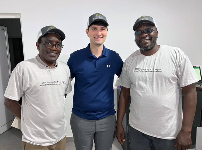 A partnership between the Mountain Sky Conference and East Angola is celebrating 20 years. “There are natural connections of taking care of the land, growing your own food, caring for community,” said the Rev. Jared Stine, pastor of Columbia Falls United Methodist Church in Columbia Falls, Mont., and a member of the team that visited in July. Pictured from left are missionary Ken Koome, Stine and missionary Kutela Katembo. The Mountain Sky Conference supports the work of Koome and Katembo in East Angola. Photo courtesy of the Rev. Jared Stine.