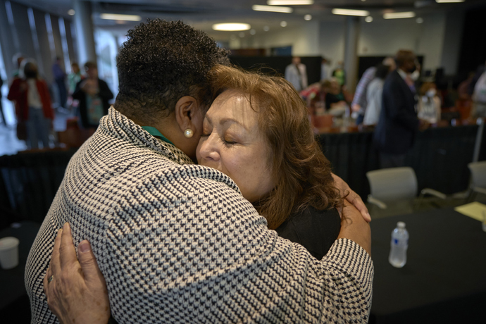 The Rev. Staci Current hugs Bishop Minerva G. Carcaño following the announcement of Carcaño’s acquittal on the fourth day of a church trial in Glenview, Ill. Carcaño was found not guilty on all four charges against her. Current, pastor of Temple United Methodist Church in San Francisco, testified in the bishop’s defense during the trial. Photo by Paul Jeffrey, UM News.