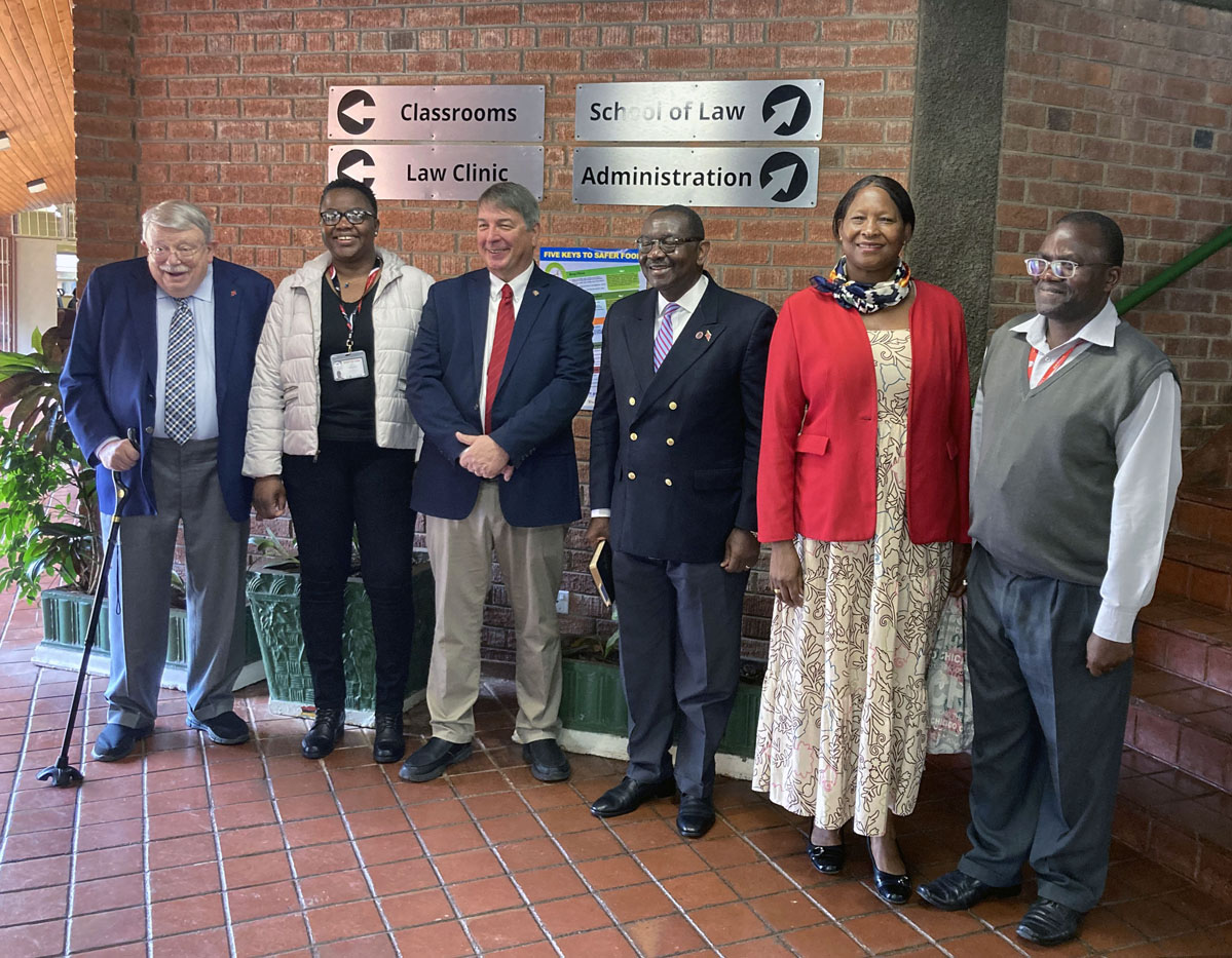 From left, Warren Plowden, Africa University acting dean Linet Sithole, Kent Fulton, N. Oswald Tweh, Lidia Gulele and Africa University Professor Christopher Munguma take a group photo after Judicial Council members Plowden, Fulton, Tweh and Gulele visited a class at the university’s law school in Mutare, Zimbabwe. Five other members of the Judicial Council, all United Methodist clergy, visited the university’s theology school. Photo courtesy of Africa University.
