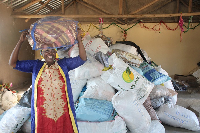 Rosemary Wangechi Mwenja receives donated items at the Tongogara Refugee Camp near Chipinge, Zimbabwe, where United Methodist refugees and asylum seekers have established a preaching point. Mwenja fled tribal violence in Kenya that killed her husband and oldest child. Photo by Kudzai Chingwe, UM News. Rosemary Wangechi Mwenja receives donated items at the Tongogara Refugee Camp near Chipinge, Zimbabwe, where United Methodist refugees and asylum seekers have established a preaching point. Mwenja fled tribal violence in Kenya that killed her husband and oldest child. Photo by Kudzai Chingwe, UM News.