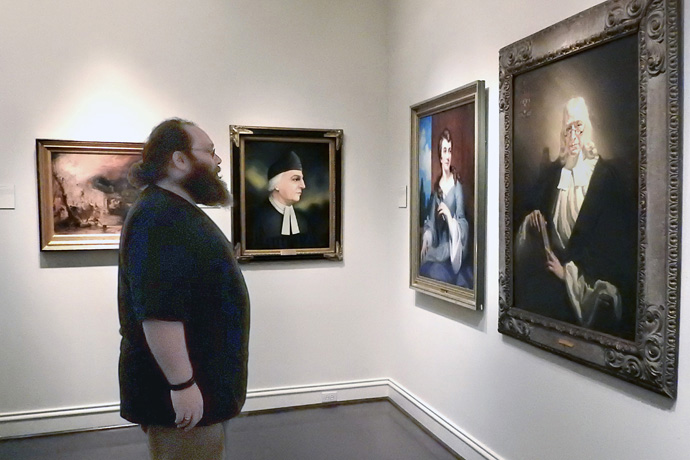 James Stanley examines a John Wesley portrait at Bridwell Library in Dallas. Bridwell, part of Southern Methodist University’s Perkins School of Theology, is the new home to Methodist historical materials that had been at the now-closed World Methodist Museum in Lake Junaluska, North Carolina. Photo by Sam Hodges, UM News.