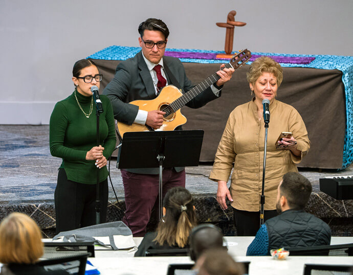 The family of the Rev. Edgar Avitia Legarda performs a poem he wrote and set to music during his service of remembrance at the first joint board meetings of the United Methodist Board of Global Ministries and United Methodist Board of Higher Education and Ministry on March 7 at Emory University in Atlanta. Avitia, a longtime staff member of the United Methodist Board of Global Ministries, died last year at age 62. Photo by Adam Bowers, Global Ministries.