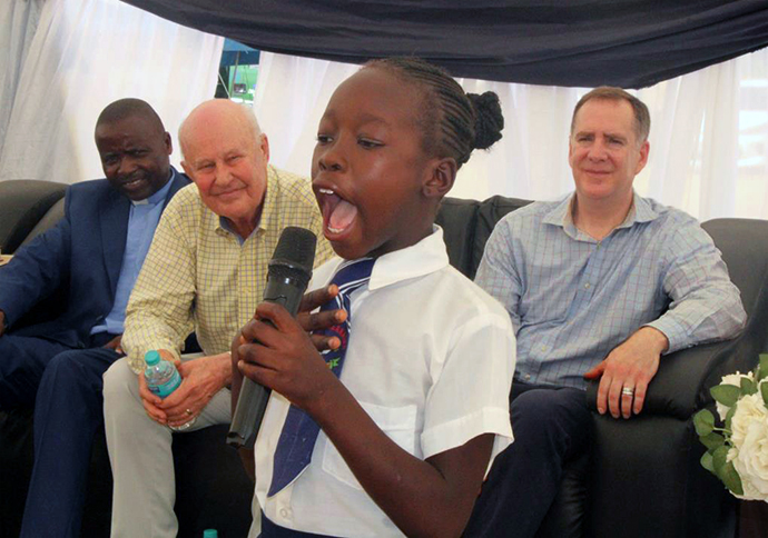Naledi Mudzedze recites a poem during the Feb. 24 dedication of a new clinic in Munyarari, Zimbabwe, funded by Bel Air United Methodist Church in Bel Air, Md., and its mission organization, Chabadza-Healing Hands Across Zimbabwe. Photo by Kudzai Chingwe, UM News.
