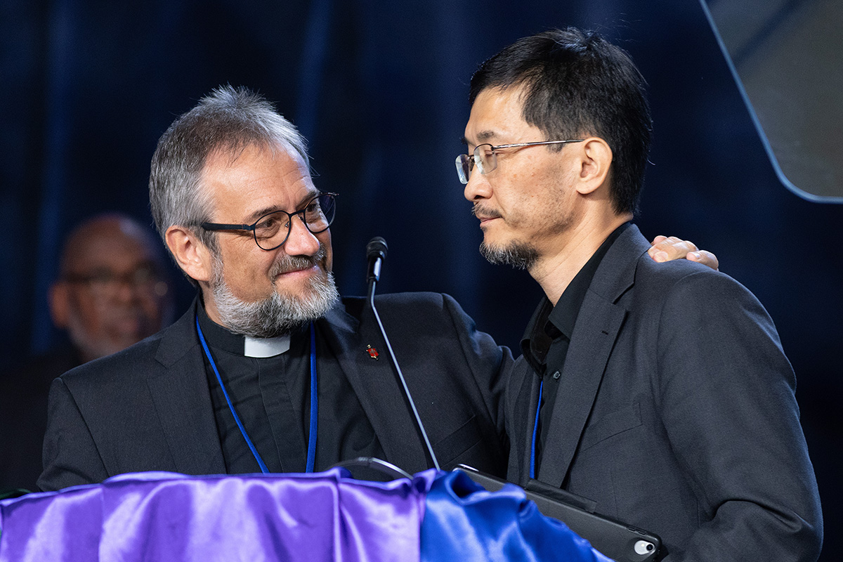 Bishop Harald Rückert (left) of Germany puts his arm around Bishop Eduard Khegay after delegates to the United Methodist General Conference in Charlotte, N.C., voted on April 25 to allow the four conferences that Khegay oversees in the Eurasia Episcopal Area to leave the denomination. Photo by Mike DuBose, UM News.