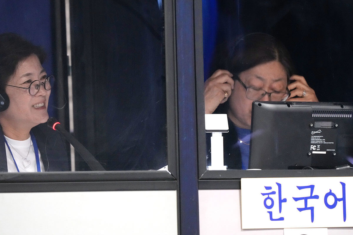 Hannah Ka and Chan Gillham interpret the conference into Korean during the United Methodist General Conference in Charlotte, N.C., on April 29. Photo by Larry McCormack, UM News.