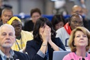 The Rev. Karen Jones of the South Carolina Conference reacts to the passage of legislation during the United Methodist General Conference, meeting in Charlotte, N.C., that will allow deacons to preside over Holy Communion in the context of their local appointments. Photo by Mike DuBose, UM News.