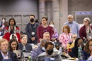 Members of the Wisconsin and Northern Illinois delegations stand while an apology for sexual misconduct within The United Methodist Church is read during the final day of the United Methodist General Conference in Charlotte, N.C., on May 3. Photo by Mike DuBose, UM News.