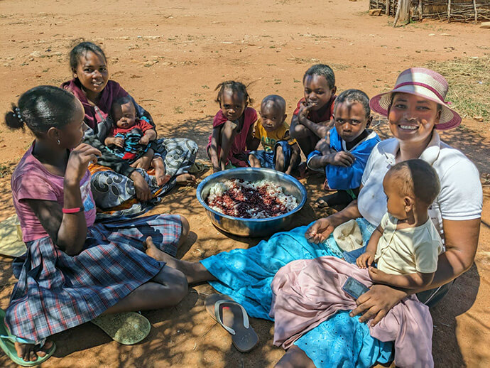 Women and children share a meal in Andranokaky, Madagascar. The food was distributed by members of Ambodifasika United Methodist Church with funding from the United Methodist Committee on Relief. Photo by Justin Rakotoarimanana.