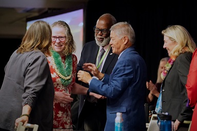 Leaders of the Western Jurisdiction greet the Rev. Sandra K. Olewine (second from left) as she takes the stage after being elected a United Methodist bishop during the jurisdictional conference July 12 in Spokane, Wash. She was elected on the 17th ballot. Photo by Patrick Scriven, Western Jurisdiction. Leaders of the Western Jurisdiction greet the Rev. Sandra K. Olewine (second from left) as she takes the stage after being elected a United Methodist bishop during the jurisdictional conference July 12 in Spokane, Wash. She was elected on the 17th ballot. Photo by Patrick Scriven, Western Jurisdiction.