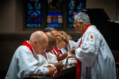 Bishop LaTrelle Easterling, who leads the Baltimore-Washington and Peninsula-Delaware conferences,  anoints the forehead of Bishop Héctor A. Burgos-Núñez during the Northeastern Jurisdictional Conference held July 10-12 in Pittsburgh. To the left is Bishop John R. Schol and Bishop Marcus Matthews. Photo by James Lee, courtesy of the United Methodists of Eastern Pennsylvania Facebook page. Bishop LaTrelle Easterling, who leads the Baltimore-Washington and Peninsula-Delaware conferences,  anoints the forehead of Bishop Héctor A. Burgos-Núñez during the Northeastern Jurisdictional Conference held July 10-12 in Pittsburgh. To the left is Bishop John R. Schol and Bishop Marcus Matthews. Photo by James Lee, courtesy of the United Methodists of Eastern Pennsylvania Facebook page.
