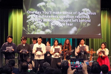 Young Methodists from around the world sing at the Korea Peace Night gathering held Aug. 15 during the World Methodist Conference in Gothenburg, Sweden. More than 250 young adults and Methodist church leaders came together to speak out against wars and racism and call for peace. Photo by the Rev. Thomas E. Kim, United Methodist News. Young Methodists from around the world sing at the Korea Peace Night gathering held Aug. 15 during the World Methodist Conference in Gothenburg, Sweden. More than 250 young adults and Methodist church leaders came together to speak out against wars and racism and call for peace. Photo by the Rev. Thomas E. Kim, United Methodist News.