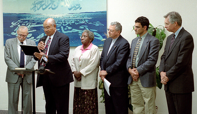 The Rev. Bruce Robbins (right) joins with other United Methodists and members of two Muslim groups in issuing a joint statement affirming a "common commitment to living together, under God, in the unity of mutual respect and compassion," during a 2001 visit to the Islamic Center of Southern California in Los Angeles in the wake of the 911 terrorist attacks. Robbins served as general secretary of the United Methodist Commission on Christian Unity and Interreligious Concerns. From left are Hassan Hathout, a founder of the center; United Methodist Bishop Melvin Talbert; Shirley Readdean, a member of the commission; United Methodist Bishop Fritz Mutti; Salam Al-Marayati, director of the Muslim Public Affairs Council; and Robbins. File photo by Mike DuBose, UM News.
